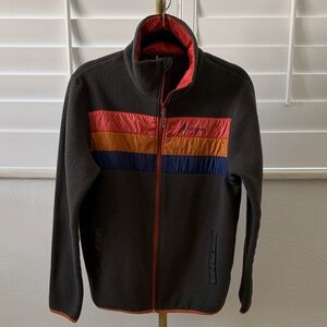 Cotopaxi Fleece Jacket w/Orange and Blue accents. 2 pockets, Women’s L, Used.